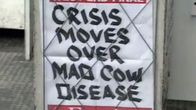 En planch var det står "CRISIS MOVES OVER MAD COW DISEASE"