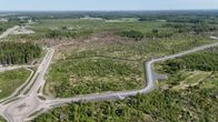 Drönarbild från område som planeras bli datacenter. På bilden syns mest skog, men även vägar.