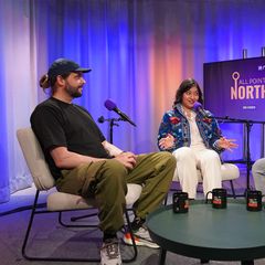 Photo shows Pieter den Heten, Megha Goswami and Yle News journalist Ronan Browne in the All Points North studio.