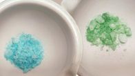 White ceramic dishes with blue, green and white crystals.