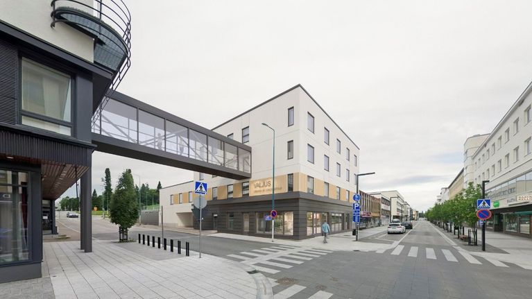 Havainnekuva rakennukset yhdistävästä yhdyskäytävästä kadun yllä.