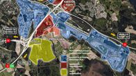 Havainnekuva kaavoituksesta Lahden Pippo-Kujalan yritysalueella. Sinisiä, punaisia, keltaisia tonttikuvioita merkitty karttaa, jossa moottoritie ja rautatieväylät.