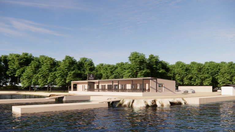 Visualisering med en modern byggnad vid vatten, omgiven av grönska.