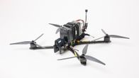 Aerial drone copter on a white surface.