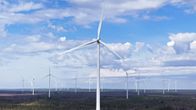 Wind turbines in a forest area.