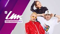 UMK-grafiikalla varustettu kuva, jossa ovat artistit Sanni, Windows95man sekä Henri Piispanen valkoisella taustalla.