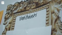 Kuvassa on kultainen taulun kehys, jossa lukee sana verifiointi.