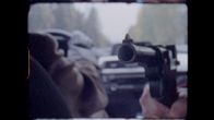 presidenten är kidnappad, i en bil en pistol som riktas mot passageraren i baksätet.