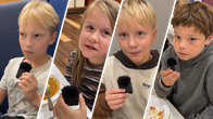 Lapsia puhumassa mikrofoniin. 