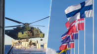 En bild på en helikopter och flaggor.