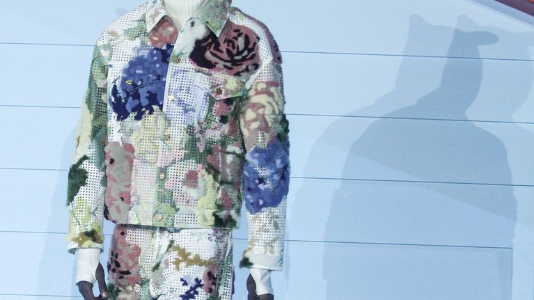 A model presents a creation from the last collection by the late US designer Virgil Abloh for Louis Vuitton during the Paris Fashion Week,​ in Paris, France, 20 January 2022. 