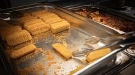 Fish fingers in an oven tray.