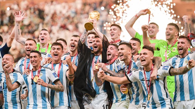 Photo shows Argentinian players celebrating winning the World Cup.