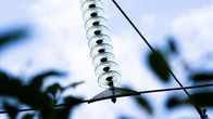Close-up photo of high voltage power transmission wires.