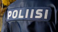 The back of a police officer. 