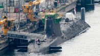 Photo shows the Royal Navy's Astute-class nuclear submarine HMS Artful anchored at a naval base in Scotland.