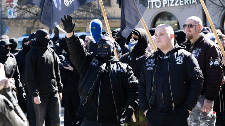 Participants doing Nazi salutes at the Blue-and-black movement vappu march in Tampere city centre 2026.