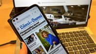 Tietokoneen ruudulla Satakunnan Kansan etusivu, tietokoneen edessä kännykän ruudulla Länsi-Suomen etusivu