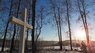 A white cross in the winter sun.