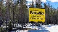 Vielä ehdit kääntyä pois -kyltti ennen Puolangan kylää