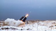 Missile launch of the NASAMs system in a snowy open training area.