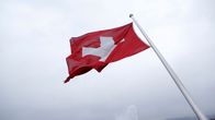 Schweiz flagga, ett vitt kors på en röd bakgrund.
