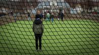 Kids in a soccer field.
