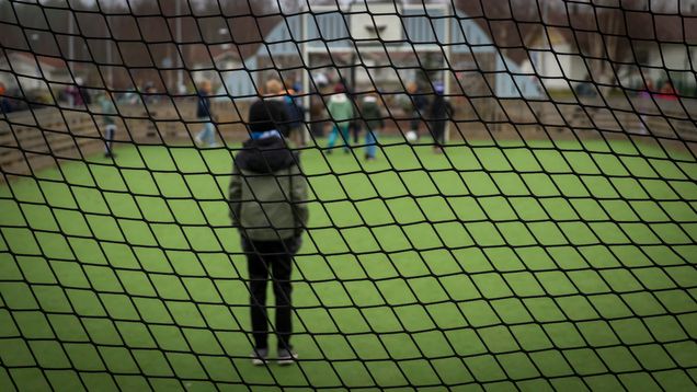 Kids in a soccer field.