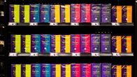 Photo shows a coffee shelf in a store.