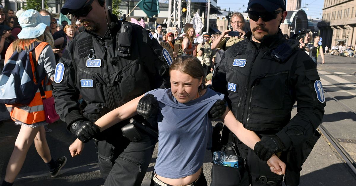 Helsinki police carry away Greta Thunberg and 'dozens' of environmental protesters