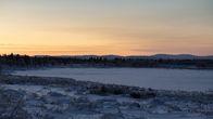 Auringonlasku Utsjoella, talvinen maisema.