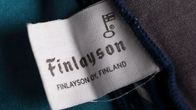 Finlaysonin tavaramerkki pesulapussa omeltuna kankaaseen.