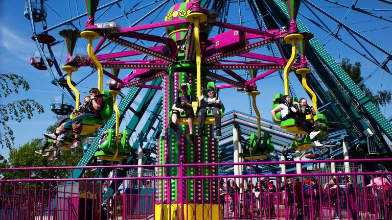 People in a carousel at Linnanmäki amusement park in Helsinki.