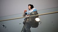 A man stands in a court hallway.