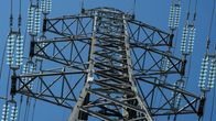 A closeup of power lines against a blue sky.