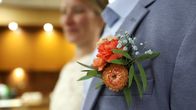 A close-up of a groom's boutonnière.