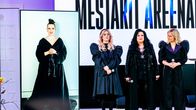 Ellinoora, Kaija Koo ja Vesala lavalla, taustakankaalla lukee Mestarit areenalla. Jenni Vartiainen on lavan vasemmalla puolella videoyhteyden kautta suurella ruudulla.