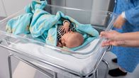 A baby in a hospital.