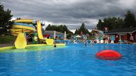 The pool area at Mikkeli's Visulahti Tourist Center on a cloudy summer day.