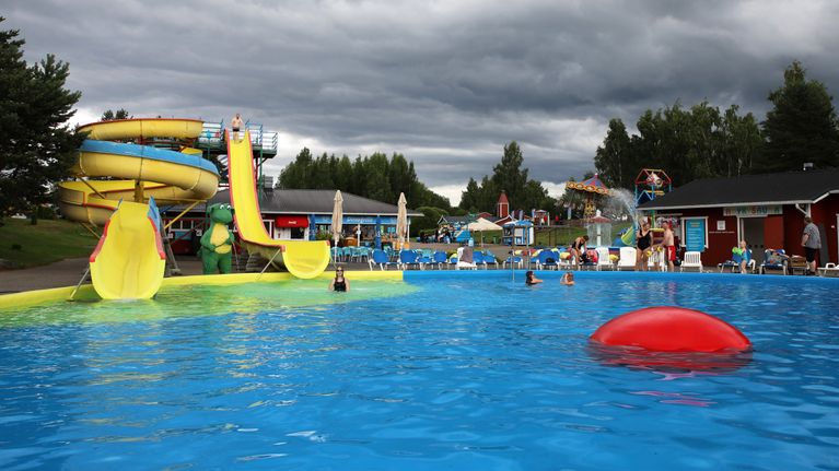 The pool area at Mikkeli's Visulahti Tourist Center on a cloudy summer day.