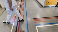 A doctor at Meilahti hospital, walking along the corridor.