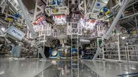 Scaffolding and equipment surrounding a fusion reactor. 