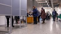 A long line of voters wait to cast their ballot