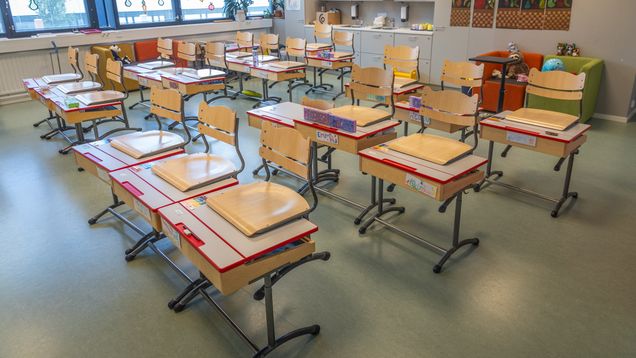 Photo shows an empty classroom.