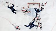 Photo shows Finland's players celebrating their late equalising goal against Switzerland in Wednesday's quarter final.