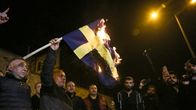 Demonstrators in Istanbul burn the Swedish flag. 