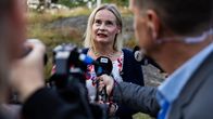 Photo shows Finland's finance minister Riikka Purra of the Finns Party speaking to reporters.