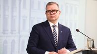 Petteri Orpo tiedotustilaisuudessa puhujanpöntön takana.