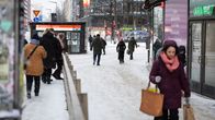 Photo shows people walking on a street in Helsinki.