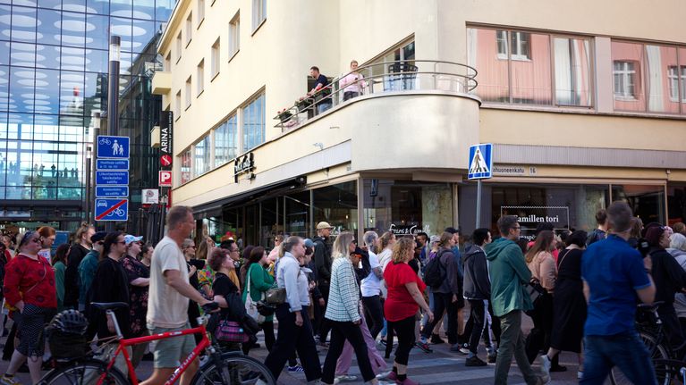 People walking as part of a demonstration in Oulu city centre.